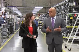 Communication Systems President Sam Mehta gets interviewed at a facility by a reporter