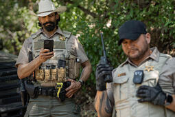 Law enforcement officers with Mission Critical Push-to-Talk devices