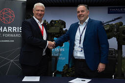 Executives from L3Harris and Thales UK shake hands