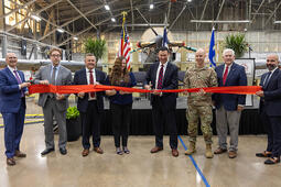 Representatives cut ribbon on a facility in Waco, Texas