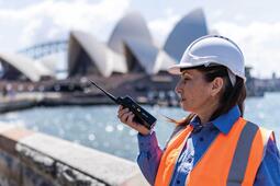 Sydney, Australia female worker talking on comms
