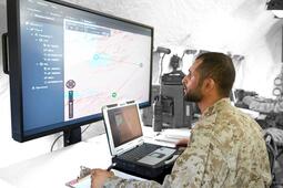 UAE soldier working on a computer