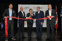 L3Harris and MHI RJ Aviation Group representatives cut ribbon