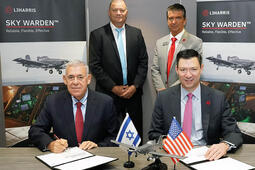 Representatives from IAI and L3Harris sign documents