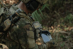 Soldier using ROVER and TNR products with C Variant