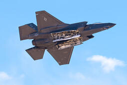 A U.S. Air Force F-35A Lightning II aircraft performs a weapons bay door pass