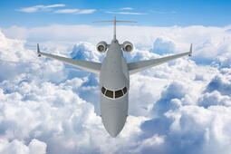 L3Harris' concept graphic of the top, front view of the AERIS X Bombardier Global 6500 Variant in flight with sky and cloud background