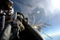 pilot in cockpit with missile out the window