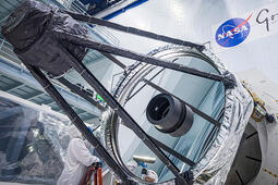 Optical Engineer Bente Eegholm performs and inspection of Roman's Primary mirror. This was taken shortly after it was lifted out of the shipping container. Credit: NASA/Chris Gunn.