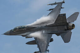 An F-16 Fighting Falcon with the Minnesota National Guard soars through the air above Duluth, Minn.