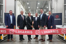 Ribbon cutting ceremony with company executives