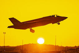F-35 takes off from tarmac at sunrise