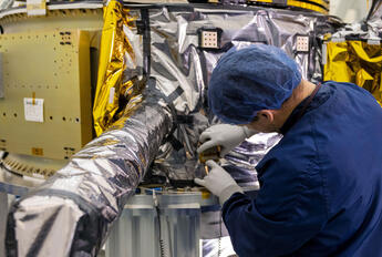 L3Harris employee working on NTS-3. Image source: L3Harris Technologies, Inc. https://www.l3harris.com/