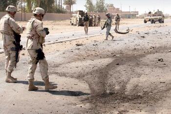 Soldiers examining EID site