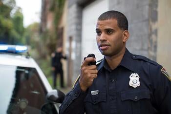 Law Enforcement Communications - Officer with Mobile Radio