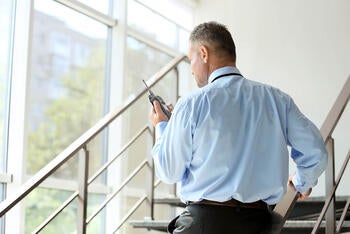 School resource officer using portable radio