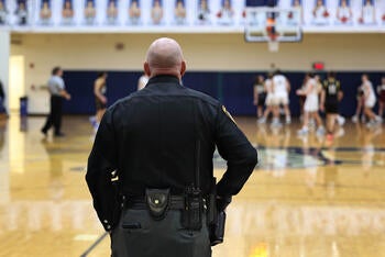 Law enforcement officer at school sporting event