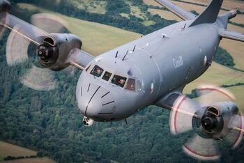 RCAF plane in flight over field