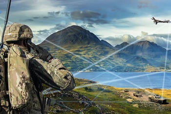 Soldier looks at battlefield with assets linked on network