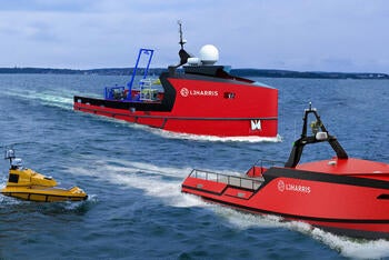 three uncrewed Surface Vehicles at sea