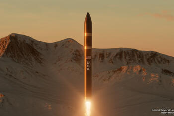 A missile launches with mountains in the background