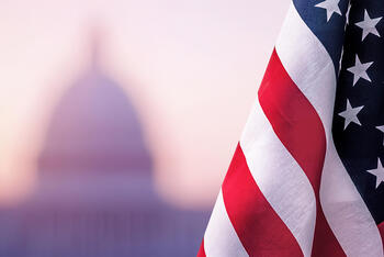 American flag with building in background