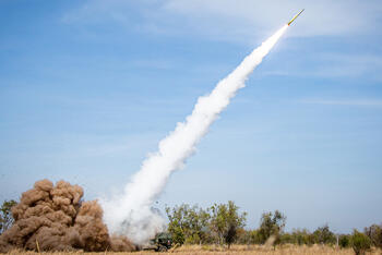 GMLRS rocket flies through sky