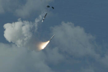 Missile flies through clouds