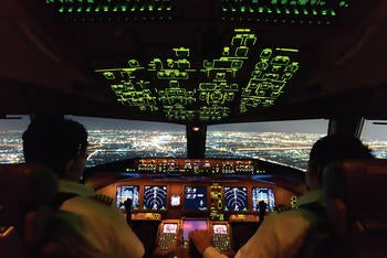 Pilots in plane cockpit