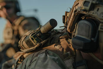Soldier with radio in the field