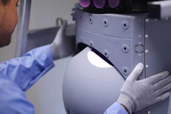 Employee assembles turret sensor