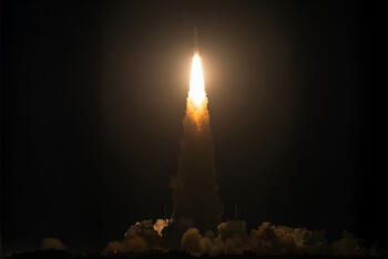 Rocket launches in night sky