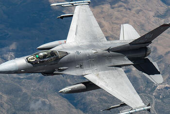 A U.S. Air Force F-16 Fighting Falcon assigned to the 16th Weapons Squadron flies over the Nevada Test and Training Range during a Weapons School Integration (WSINT) mission, June 9, 2025. Credit: Staff Sgt. Jose Miguel T. Tamondong. Thumbnail image.