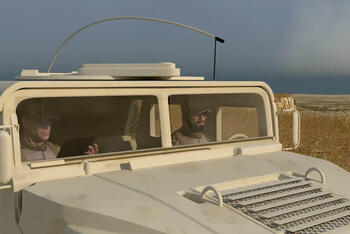 Soldiers in vehicle using HF radio