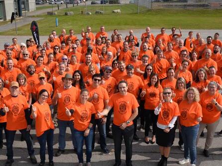 L3Harris employees in Mirabel, Quebec, proudly wore their "Mother Bear Energy" shirts on September 28, 2023.