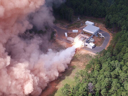 Rocket motor test fires in a forest
