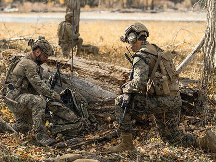 Joint forces warfighters with communications equipment