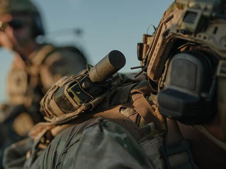 Soldier with radio in the field