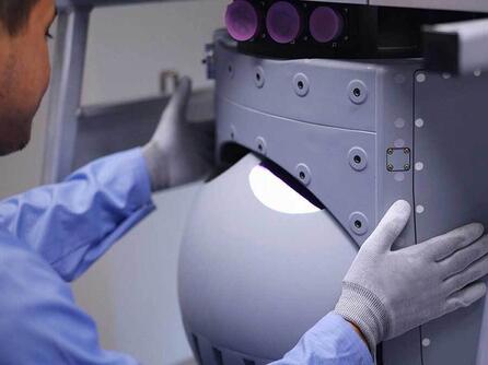 Employee assembles turret sensor