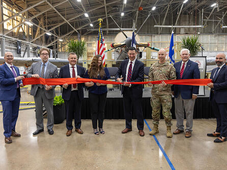 Representatives cut ribbon on a facility in Waco, Texas