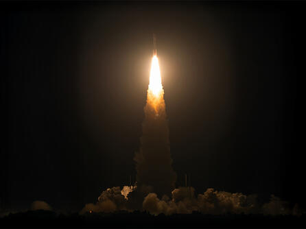 Rocket launches in night sky