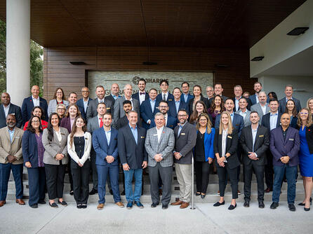 Group of leaders and employees gathered for awards ceremony