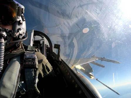 pilot in cockpit with missile out the window