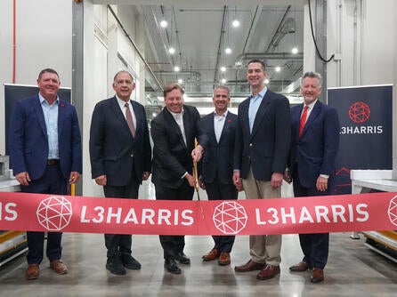 Ribbon cutting ceremony with company executives