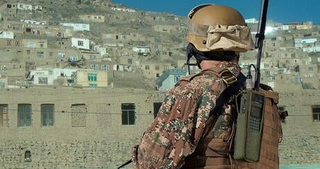 Soldier wearing handheld Falcon® Radio