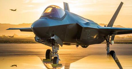 The sun sets behind an Australian F-35A Lighting II at Luke Air Force Base, Ariz., June 27, 2018. The first Australian F-35 arrived at Luke in December, 2014. Currently six Australian F-35's are assigned to the 61st Fighter Squadron where their pilots train alongside U.S. Air Force pilots. (U.S. Air Force photo by Staff Sgt. Jensen Stidham)