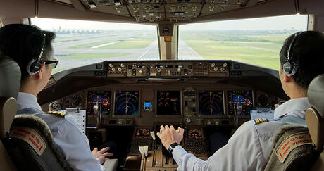 FAA Data Communications Pilots at controls in cockpit thumbnail image
