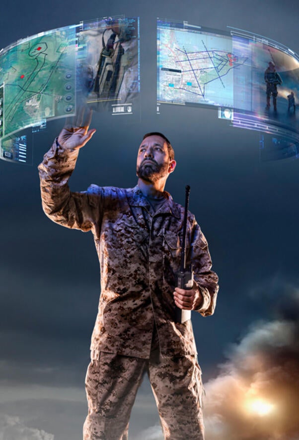 Solider using a hologram interface.