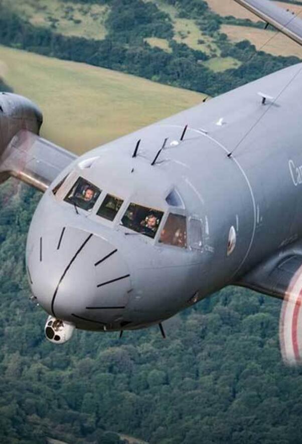 RCAF plane in flight over field