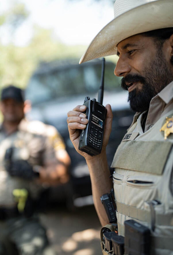 Law enforcement officer with P25 portable radio